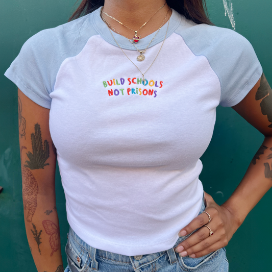 Build Schools Not Prisons | Embroidered Baby Tee